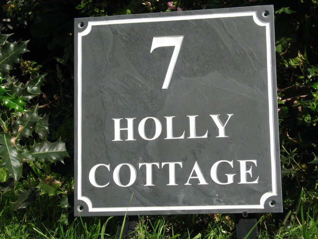 Slate house sign measuring 300mm x 300mm with the address and scalloped border deep engraved and infilled with white monument paint