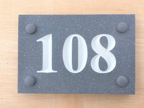 House sign measuring 150mm x 100mm using grey Corian with the number 108 deep engraved and infilled with white monument paint