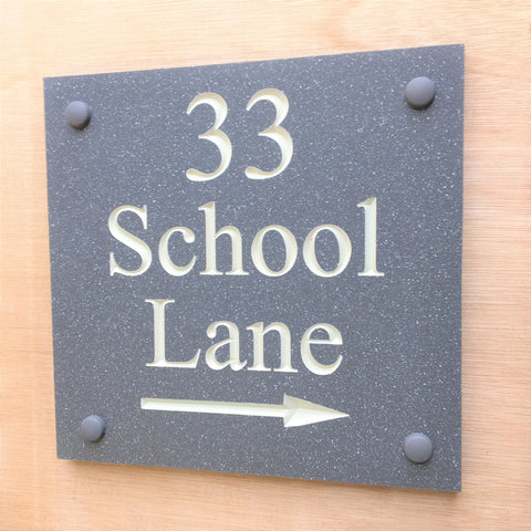 House sign measuring 200mm x 200mm using grey Corian with the address and numbers deep engraved and infilled with white monument paint