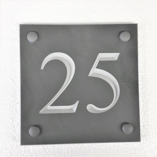 Slate house sign with house number 25 on a 100mm x 100mm grey slate sign using Times New Roman font -on charcoal slate with white paint