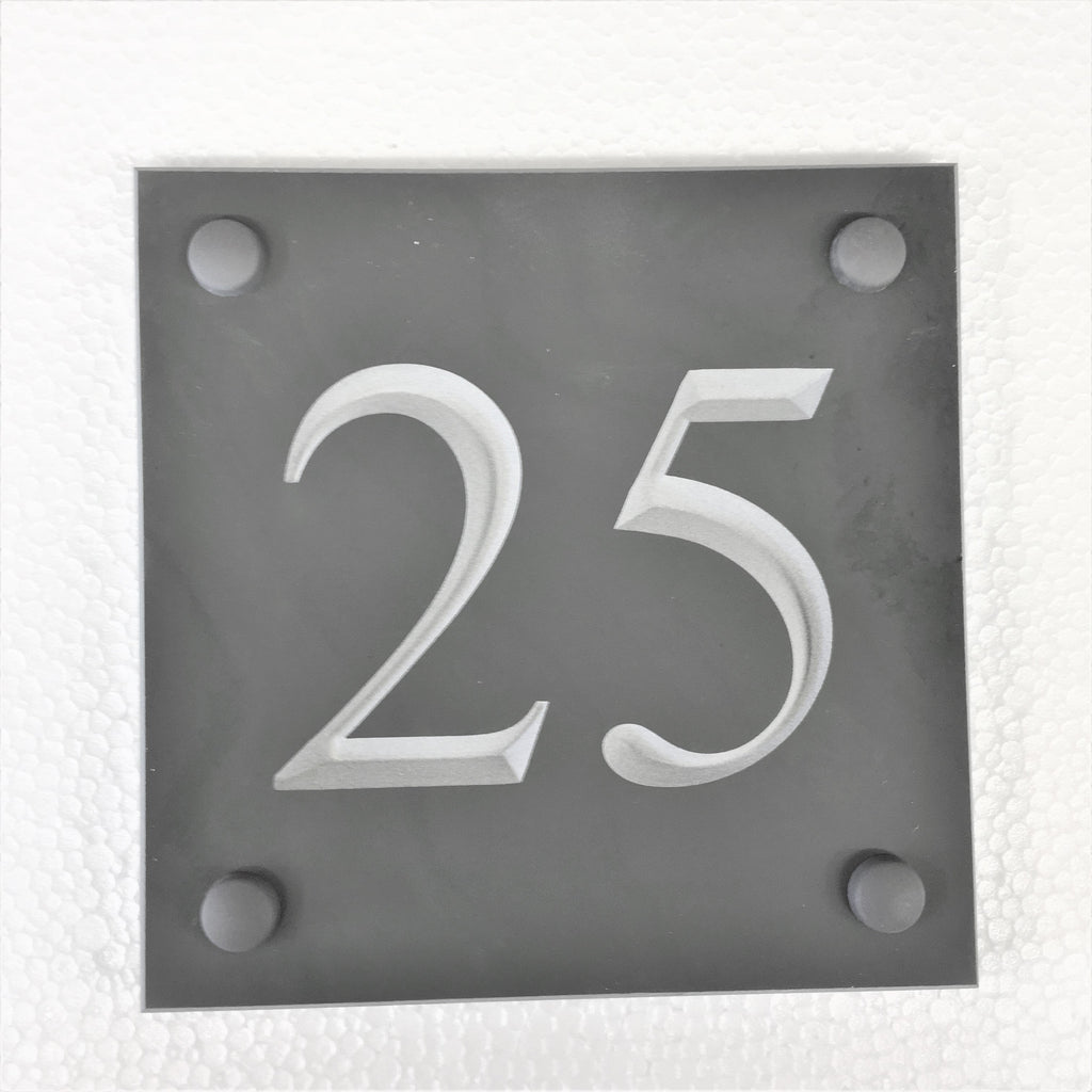 Slate house number 25 on a 100mm x 100mm grey slate using Times New Roman font -on charcoal slate with white paint